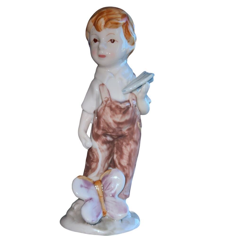 Boy with Paper Airplane and Butterfly Vintage Ceramic Figurine - 6 ½” H